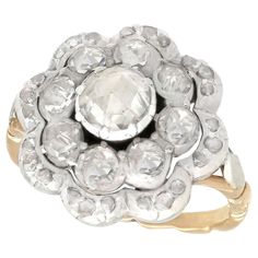 an antique diamond cluster ring in yellow gold and white gold, circa 1920's