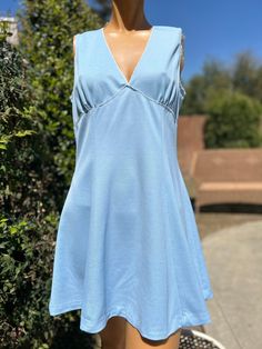 Here is a vintage 1970s polyester tennis dress.Made by Rhia.Following are the measurements. Bust 38",waist 34",Hips 50",length 33".Baby Blue polyester fabric.Zips up the back. Tiny white lace on bodice.Ties at neck. Keyhole back design.In nice vintage condition. Please take special consideration of measurements. 1970s sizing was very small to today's standards. Tennis dresses were very short not like a regular dress. So please take special note of length. If you live overseas please email me first before purchasing for mailing cost. Price quoted is for USA only Tennis Dress, Tie Backs, Sport Fitness, Baby Blue, White Lace, Sports Women, 1970s, Bathing Beauties, Lace