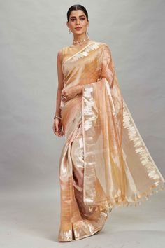 Shop peach and silver striped tissue Banarasi saree online in USA. Look your best on festive occasions in latest designer sarees, pure silk sarees, Kanjivaram silk saris, handwoven saris, tussar silk sarees, embroidered saris from Pure Elegance Indian clothing store in USA.-full view Banarasi Sari, Tussar Silk Sarees, Indian Clothing Store, Latest Designer Sarees, Fashion Journals, Tussar Silk Saree, Banarasi Saree, Indian Clothing, Traditional Fabric