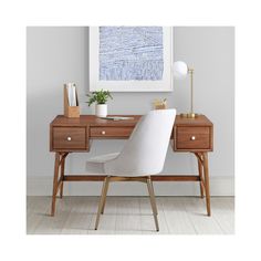 a white chair sitting next to a wooden desk