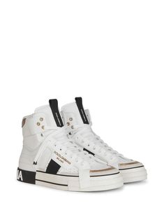 White/black/gold calf leather/leather high-top lace-up sneakers from DOLCE & GABBANA featuring round toe, front lace-up fastening, perforated detailing, gold-tone hardware, logo patch at the tongue, branded insole, padded ankle, logo-embellished side panels, logo print to the rear and flat rubber sole. Custom High-top Leather Sneakers With Elastic Laces, Custom Leather High-top Sneakers With Elastic Laces, Leather High-top Sneakers With Elastic Laces, Luxury High-top Sneakers With Contrast Sole, Luxury High-top Sneakers With Boost Midsole, High-top Leather Sneakers With Elastic Laces, High-top Sneakers With Boost Midsole, High-top Skate Shoes With Contrast Sole, Sporty High-top Sneakers With Elastic Laces