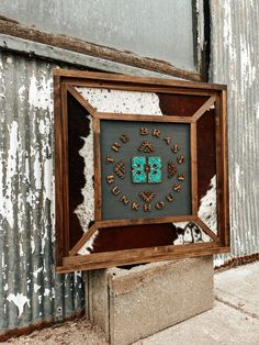 "The perfect-sized jewelry cabinet!  These cabinets feature a four-sided framed wood canvas for customization and jewelry-hanging interior design! It can be framed in Pendleton, cowhide, or any style seen in our Bunkhouse Mirror Collection. Please note your preference in the comments.  Please email your logo/brand image via Etsy messages or BBunkhouse@outlook.com. The default is turquoise stone inlay; if you prefer another stone, please make a note in the comments.  Chic, stylish, and functional! Overall dimensions are 22.5\" x 22.5\". This item is handmade to order. Please allow 4-6 weeks turnaround time." Western Jewelry Holder, Cowhide Crafts, Western House Ideas, Western Projects, Cowhide Jewelry, Western Decor Diy, Belt Buckle Display, Western Business, Country Bedroom Decor