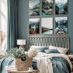 a bedroom with blue walls and pictures on the wall