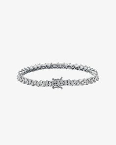 Introducing our Princess Mini Stack Diamond Tennis Bracelet, a fusion of elegance and everyday versatility. This bracelet, set with 4 carats of 2x2mm princess-cut white diamonds and 0.95 carats of baguette-cut white diamonds, is more than just an accessory—it's a statement of style. Details 18k yellow gold, rose gold or white gold 4.00 carats of 2x2mm princess-cut white diamonds 0.95 carats of baguette white diamonds Bracelet measures 7" inches in length Box clasp with safety lock fastening 4.5m Diamonds Bracelet, Diamond Stacks, Diamond Tennis Bracelet, Vs Diamond, Box Clasp, Tennis Bracelet Diamond, Baguette Cut, Princess Cut Diamonds, White Diamonds