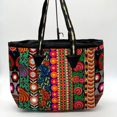 Attractive Color Combination. Mirror And Thread Work Done All Over The Tote. Black Cotton Fabric Lining Inside. One Small Inside Pocket With Zipper Closure. Zipper Closure On Top. Ethnic Tribal Design. Attractive Bright Color Combination. Size: 19”X12.5”X 5”. Handle Drop 10” Handmade By Tribe Azure Fair Trade Artisans. Exquisite Handmade Woven Unique Patchwork Tapestry And Mirrors.Each Bag Is Individually Made By Hand, Giving Each Bag A Unique Touch. Handicraft, Fair Trade, Bohemian, Banjara Chic Multicolor Embroidered Bag, Handmade Black Bags For Spring, Bohemian Multicolor Shoulder Bag For Shopping, Black Bohemian Rectangular Bag, Embroidered Black Summer Bags, Black Embroidered Bags For Summer, Bohemian Shoulder Bag With Multicolor Embroidery For Spring, Handmade Black Bohemian Bags, Bohemian Shoulder Bag For Shopping