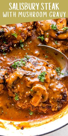 steak with mushroom gravy in a skillet on top of a white plate