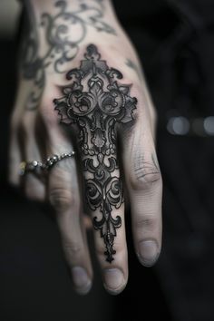 Intricate black tattoo covering the entire middle finger and part of the hand, featuring ornate designs. Hand To Forearm Tattoo, Dark Finger Tattoos, Black Finger Tattoo, Goth Tattoo Sleeve, Most Unique Tattoos, Henna Back Tattoo, Finger Tattoos Ideas, Tattoo Fingers, Henry Tattoo