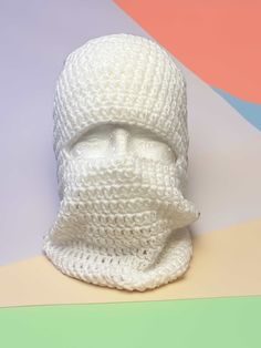 Embrace winter elegance with the Koka Balaclava, a sleek all-white accessory designed for warmth and coziness. Versatile enough to complement any outfit, this balaclava effortlessly blends style with comfort. Practicality is paramount, as it is machine washable for easy care. With a commitment to efficiency, the Koka Balaclava ships in just one business day, ensuring you can enjoy its snug warmth promptly and effortlessly elevate your winter wardrobe in a timeless hue. Adult Size Machine Washable 100% Acrylic Ships in one business day White Knitted Balaclava For Cold Weather, One-size Warm White Balaclava, White Warm Balaclava One Size, Warm White Balaclava One Size, White Warm One-size Balaclava, Warm White One-size Balaclava, White Full Face Balaclava For Winter, Warm White Balaclava For Winter, Crochet Balaclava