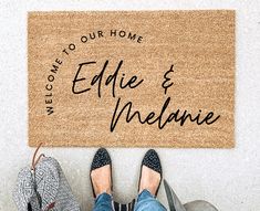 someone standing in front of a welcome mat that reads welcome to our home, eddie and melane