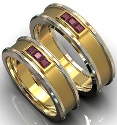 two gold wedding bands with pink sapphire stones