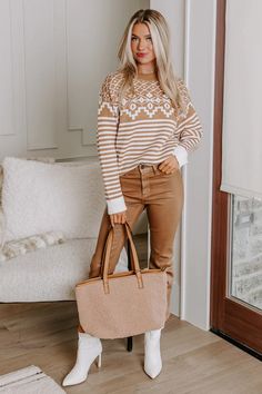 Set your eyes on snowy skies with this cozy sweater! - Unlined knit material with striped and abstract patterns - A crew cut neckline - Long, loose sleeves with rolled cuffs - A relaxed silhouette that ends in a straight hemline Knitting Materials