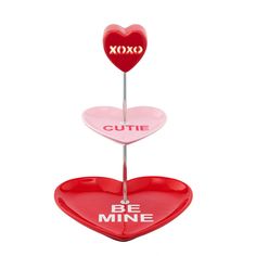 two heart shaped candy boxes with the words xoxo cutie and be mine on them