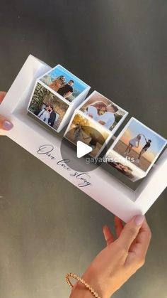 a hand holding an open photo album with four pictures on the front and back cover