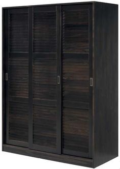 an armoire with wooden shutters on the front and sides, in dark wood