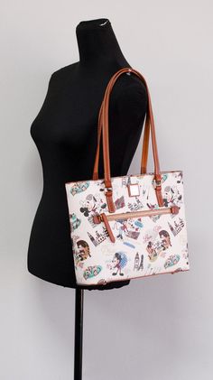 Style: Dooney & Bourke EPCOT International Food & Wine Festival 2022 Tote Bag Material: Printed Coated Cotton Features: Inner Zip and Slip Pockets, Outer Zip Pocket, Canvas Lined, Bottom Studs Measures: 12" W x 10" H x 3.75" D MSRP: $298 Dooney Bourke Handbags 2022, Festival 2022, Global Cuisine, International Food, Wine Festival, International Recipes, Dooney Bourke, Wine Recipes, Canvas Tote