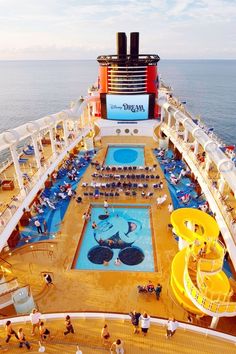 people are on the deck of a cruise ship as it passes through the water and slides