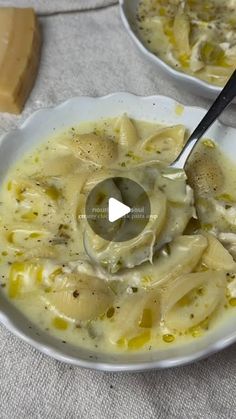 two white bowls filled with pasta and sauce