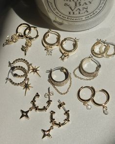 When the hopeless romantic gets a rock n roll makeover. These chunky hoops are the ultimate mash-up: rows of sparkly cz stones take center stage while the dangling chain give them an edge. 14k gold plated brass & palladium Steel posts Hoop measures approx 17mm Accented with cubic zirconia gems for added sparkle Coated for long-wearing protection Lotus Earrings, A Rock, Hopeless Romantic, Center Stage, Cz Stone, Rock N, Rock N Roll, Lotus, Cubic Zirconia