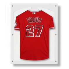 a red baseball jersey hanging in a white frame with the number 27 printed on it