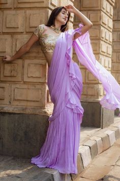 Purple pre-draped ruffled saree in chinon base. Paired with a floral thread embroidered padded blouse and belt. - Aza Fashions Draped Blouse With Ruffles, Elegant Draped Ruffle Blouse, Fitted Blouse With Ruffles And Traditional Drape, Fitted Ruffled Blouse With Traditional Drape, Elegant Draped Saree With Ruffles, Wedding Saree With Ruffles And Draped Style, Wedding Saree With Draped Ruffles, Fitted Draped Blouse With Ruffles, Festive Ruffled Pre-draped Saree