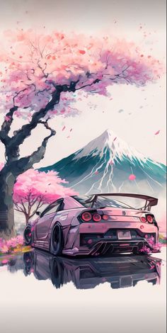 a car is parked under a tree with pink flowers on it and mountains in the background