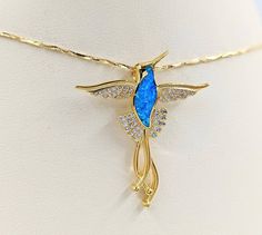 "This necklace is an adorable sterling silver gold plated hummingbird necklace on stunning sterling (gold plated) chain. As with all BellaIpsa back-closure necklaces, the lobster clasp is designed for both beauty and ease, utilizing an easy to grasp infinity (figure eight) 925 sterling clasp, accompanied by a sterling silver infinity link (perfect for adding a BellaIpsa back piece!). No longer will you want to cover up the clasp on your necklace! Item specifics are as follows: Charm: Sterling Si Gold Hummingbird, Hummingbird Necklace, Hummingbird Pendant, Necklace Opal, Humming Bird, Gold Sun, Bee Necklace, Pendant Gold, Hummingbirds