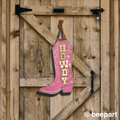 Howdy! Our cowboy boot door hanger is a great way to send out a warm welcome.  Hang it on a door or hang it in an entranceway.  Made from maple veneer plywood and matte vinyl,  this door sign measures approx. 8.5" wide by 13.25" tall with a depth of approx. 0.5".  Adorned in matte vinyl color accent of your choice with metallic gold starbursts and gold lettering.  *Change HOWDY to a personalized name!* *FREE SHIPPING on regular parcel service, United States and Canada! All of our products are pr Boot Door Hanger, Pink Cowboy Boot, Boot Wall, Chic Cowgirl, Pink Cowboy Boots, Cowboy Chic, Pink Cowboy, Country Door, Music Decor