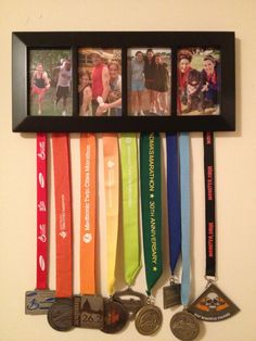 a group of medals hanging on a wall