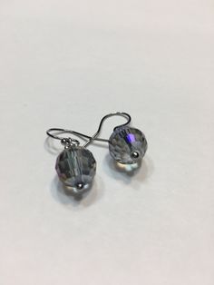 "Blue Aurora Borealis 10mm faceted disco ball glass beads, stainless steel hook wire dangling earrings. 1\" top to bottom, dangle 1/2 inches. Hand made Jewelry! Thanks for stopping by!" Nickel-free Crystal Earrings For Party, Nickel-free Round Crystal Earrings For Party, Faceted Crystal Party Earrings, Nickel Free Czech Glass Beaded Earrings For Party, Nickel-free Czech Glass Beaded Earrings For Parties, Glass Bead Earrings For Party, Glass Round Bead Earrings For Party, Adjustable Crystal Earrings With Faceted Beads, Adjustable Faceted Round Bead Earrings