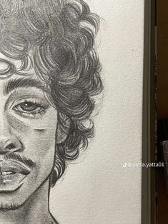 a pencil drawing of a man with curly hair