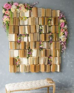 a wall made out of books and flowers