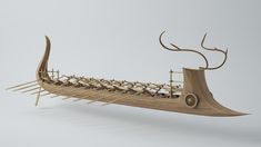 a wooden boat with many long sticks sticking out of it's hulls and horns