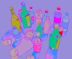 there are many different colored bottles on the table