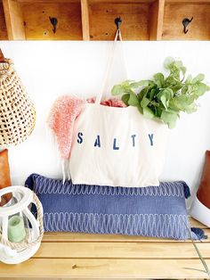 "The SALTY Oversized canvas tote bag is perfect for a trip to the beach! Also perfect to use as a reusable shopping bag, or everyday carryall. Available with text in several colors... check out the variations! This bag is made from 100% thick, sturdy canvas. AVAILABLE IN TWO SIZES * Large - 19.5\" x 13\" with a 4\" gusset *Jumbo - 23\" x 13\" with a 6\" gusset These bags are hand painted using non-toxic fabric paint. The technique used creates an attractive distressed appearance to the text that Natural Cotton Beach Bag For Summer, Natural Cotton Beach Bag For Beach Season, Large Capacity Cotton Bag For Beach Season, Summer Cotton Tote Canvas Bag, Summer Style Cotton Tote Canvas Bag, Trendy Cotton Canvas Bag For Beach Season, Summer Style Cotton Canvas Tote Bag, Cotton Beach Tote Bag For Beach Season, Summer Canvas Bag With Letter Print For Shopping