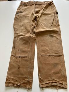 Mens Carhartt Double Knee Trouser Heavy duty material 1990s vintage  Regular Fit  Zip Fly  Beige Waist 38 inch Leg Length 32 inch **Sizes are exact measurement of the jean and may differ from the tag size** Please note due to the nature of these being workwear jeans there will be cool signs of fraying / paint and fading marks. All adding to the character of the piece** Item in great workwear condition overall Vintage Cargo Pants With Pockets For Fall, Vintage Straight Leg Cargo Pants For Streetwear, Vintage Straight Leg Work Pants With Hip Pockets, Vintage Full Length Cargo Pants For Streetwear, Vintage Full-length Bottoms For Streetwear, Vintage Fall Cargo Pants With Pockets, Vintage Pants With Belt Loops For Streetwear, Vintage Straight Leg Work Pants, Vintage Wide Leg Work Pants With Hip Pockets