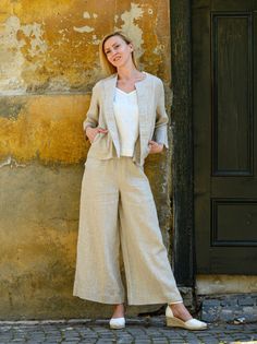 "MADE TO ORDER - Basic long, flared linen pants, fluid and breezy, ideal for hot summer days. Featuring a minimalist design, they can be easily matched with any top of your choice: boxy, cropped, fitted or even tunics. Finished in a topstitched elastic waistband to fit and flatten all body shapes. Shown here in Oatmeal 200 gsm medium weight linen. SIZING To choose the right size, check out our body measurements chart displayed in the product listing photos. If you need specific sizing recommenda Linen Wide-leg Pants For Spring, Spring Linen Wide-leg Bottoms, Chic Linen Culottes For Spring, Spring Linen Wide Leg Pants, Chic Flax Trousers, Spring Linen Wide Leg Culottes, Spring Wide Leg Linen Culottes, Spring Relaxed Fit Wide Leg Pants In Flax Color, Spring Wide Leg Pants In Flax With Relaxed Fit