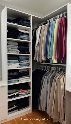 the closet is full of clothes and folded shirts