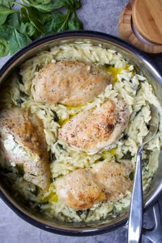 some chicken and pasta in a pan on a table