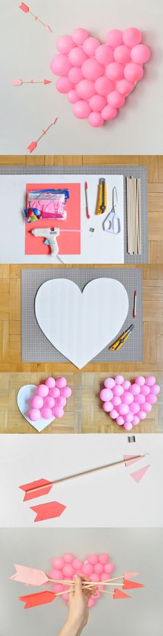 pink and white balloons are being made into heart shapes