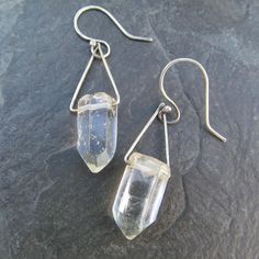 Healing Quartz Crystal Dangling Earrings Clear Gemstone Drops: These rectangle hoop earrings are hand made out of hammered sterling silver and natural polished clear Quartz crystal points. They measure about 2" total length by approximately 1/2" wide. 100% hand made by myself in my little home studio. You will receive a pair similar to the pair pictured. Enter my shop: https://www.etsy.com/shop/artdi Join me on Facebook: https://www.facebook.com/Artdi-Diana-Anton-Jewelry-Design-44805607932/ Find Minimalist Sterling Silver Crystal Earrings, Minimalist Sterling Silver Crystal Earrings For Everyday, Everyday Minimalist Sterling Silver Crystal Earrings, Minimalist Nickel-free Clear Jewelry, Minimalist Clear Nickel-free Jewelry, Modern Silver Crystal Earrings With Ear Wire, Minimalist Sterling Silver Dangle Crystal Earrings, Sterling Silver Minimalist Dangle Crystal Earrings, Modern Sterling Silver Dangle Crystal Earrings