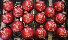 twelve red christmas ornaments with justice revival written on them