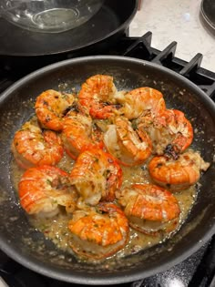 cooked shrimp and garlic cooking in a skillet