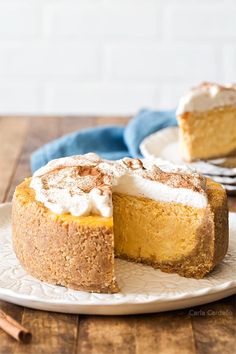 a cheesecake on a plate with one slice cut out