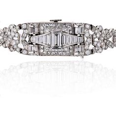 Transport yourself to the enchanting era of Art Deco with this mesmerizing Glycine Diamond Platinum Watch. Prepare to be captivated by its timeless beauty and exquisite craftsmanship. Adorned with a dazzling array of approximately 6.50 carats of round and baguette cut diamonds, this watch is truly a sight to behold. The diamonds, with their enchanting H-I color and remarkable VS clarity on average, radiate a mesmerizing brilliance that will leave you breathless.Every glance at this watch's dial, Emerald Cut Diamond Ring, Baguette Cut Diamond, Famous Designers, Platinum Metal, Gorgeous Art, Baguette Cut, Emerald Cut Diamonds, Vintage Pins, Estate Jewelry