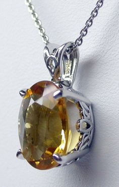 YELLOW CITRINE NECKLACE STERLING SILVER/ GENUINE YELLOW CITRINE PENDANT/ NOVEMBER BIRTHSTONE NECKLACE/ GENUINE GEMSTONE PENDANT/ STERLING SILVER CITRINE NECKLACE Genuine oval Citrine 5.78 ct medium yellow 12 mm by 10 mm sterling silver handmade and set by me. The basket has handmade scroll work on the sides. The gemstone is vibrant yellow citrine set in a hand made 4 prong sterling silver setting . The chain is available in 16 or 18 inches. please specify the length when ordering. free shippingw Oval Citrine Amber Necklace, Oval Amber Citrine Necklace, Oval Amber Necklace For Anniversary, Oval Citrine Gemstone Necklaces, Oval Yellow Citrine Necklace, Yellow Oval Citrine Necklace, Oval Citrine Gemstone Necklace, Yellow Oval Citrine Jewelry, Yellow Gemstone Oval Pendant Necklace