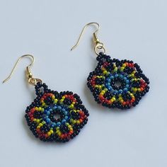 Dangling earrings woven and handmade by myself. They are made of round MIYUKI glass beads in black, blue, yellow, orange, red and green colors. Its attachments are gold-plated brass ear hooks without nickel or lead. They are also anti-allergy. The total height of the loops is 5.5 cm and the width is 3 cm. The weaving thread I use is a special jewelry nylon thread from MIYUKI; Their boho style and varied colors will look great on all your summer outfits. All my jewelry is packaged in a box and an Boho Style Earrings, Special Jewelry, Dangling Earrings, Earrings Boho, Style Earrings, Organza Bags, Yellow Orange, Boho Earrings, Orange Red