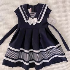 Never Worn Navy Fitted Cute Dress, Cute Fitted Navy Dress, Spring Sleeveless School Uniform Dresses, Navy School Dress For Spring, Blue Cotton Sailor Dress, Blue Sailor Cotton Dress, Navy Short Sleeve School Dress, Blue Sailor Style Cotton Dress, Cute Navy School Dress