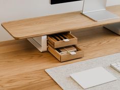 a computer desk with a keyboard and mouse