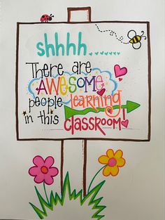 a sign that says shh there are awesome people learning in this classroom with flowers