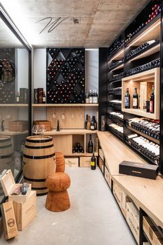 the wine cellar is stocked with many bottles